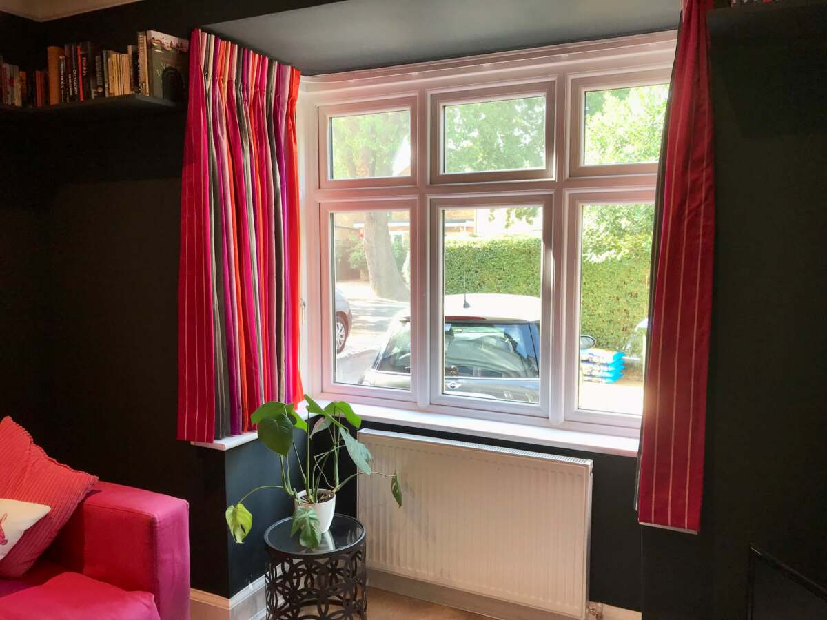 Pink & orange striped curtains for bay window